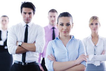 Image showing business woman standing with her staff in background