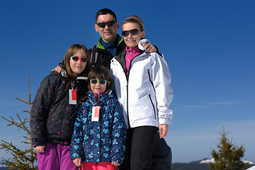 Image showing portrait of happy young family at winter