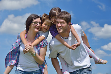 Image showing happy young family have fun outdoors