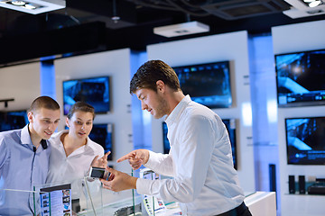 Image showing Young couple in consumer electronics store