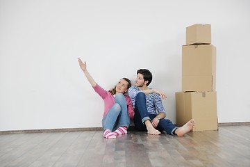 Image showing Young couple moving in new house