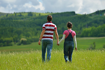 Image showing Portrait of romantic young couple smiling together outdoor