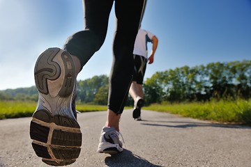 Image showing Young couple jogging