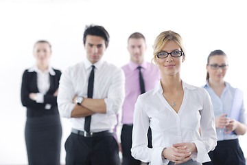 Image showing business woman standing with her staff in background