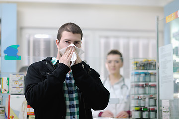 Image showing pharmacist suggesting medical drug to buyer in pharmacy drugstor