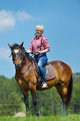 Image showing happy woman  on  horse