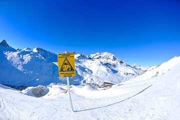 Image showing Sign board at High mountains under snow in the winter