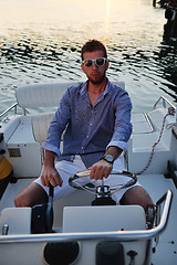 Image showing portrait of happy young man on boat