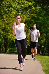 Image showing Young couple jogging