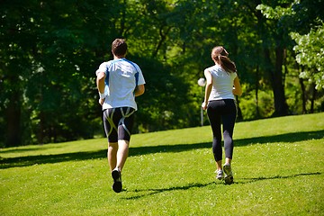 Image showing Young couple jogging