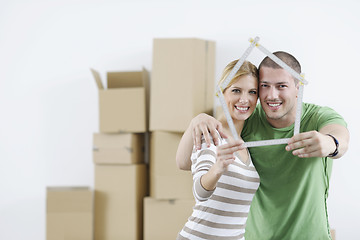 Image showing Young couple moving in new home