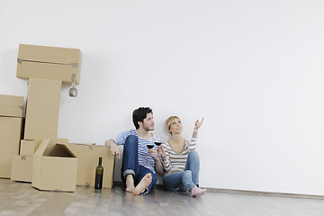 Image showing Young couple moving in new home