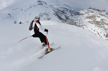 Image showing skiing on fresh snow at winter season at beautiful sunny day