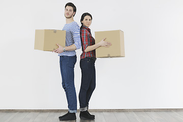 Image showing Young couple moving in new home