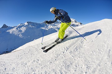 Image showing skiing on fresh snow at winter season at beautiful sunny day