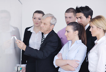Image showing Senior business man giving a presentation