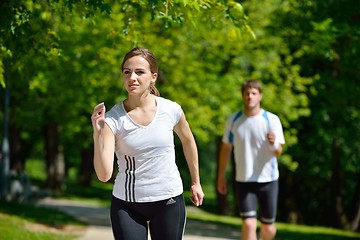 Image showing Young couple jogging