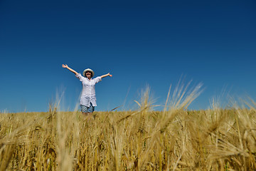 Image showing young woman in wheat field at summer