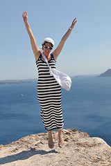 Image showing Greek woman on the streets of Oia, Santorini, Greece