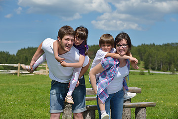 Image showing happy young family have fun outdoors