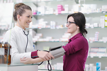 Image showing Checking blood pressure and heart rate