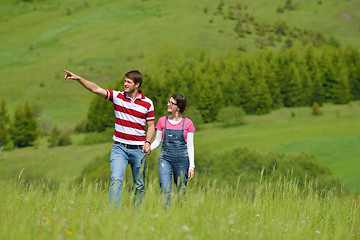 Image showing Portrait of romantic young couple smiling together outdoor