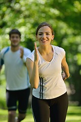 Image showing Young couple jogging at morning