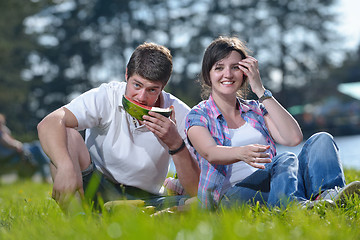 Image showing happy young couple having a picnic outdoor