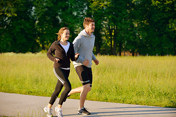 Image showing Young couple jogging