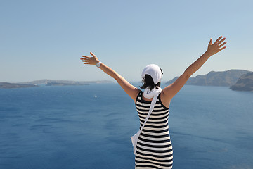 Image showing Greek woman on the streets of Oia, Santorini, Greece