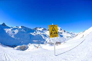 Image showing Sign board at High mountains under snow in the winter