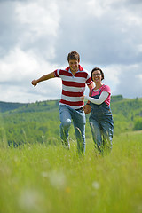 Image showing Portrait of romantic young couple smiling together outdoor