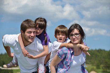 Image showing happy young family have fun outdoors