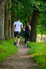 Image showing Young couple jogging