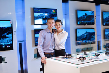 Image showing Young couple in consumer electronics store