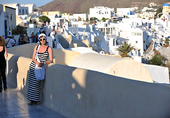 Image showing Greek woman on the streets of Oia, Santorini, Greece