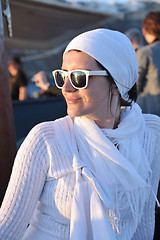 Image showing Greek woman on the streets of Oia, Santorini, Greece