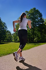 Image showing Young beautiful  woman jogging