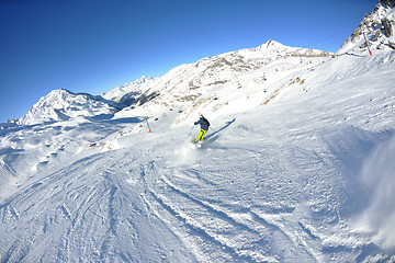 Image showing skiing on fresh snow at winter season at beautiful sunny day