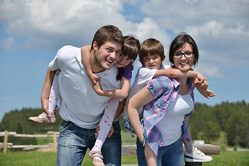 Image showing happy young family have fun outdoors