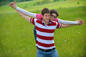 Image showing Portrait of romantic young couple smiling together outdoor