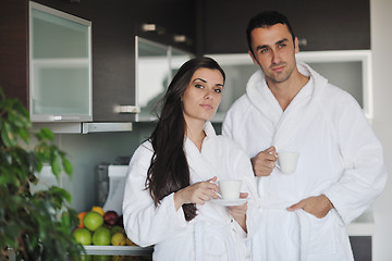 Image showing Young love couple taking fresh morning cup of coffee