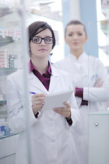 Image showing team of pharmacist chemist woman  in pharmacy drugstore