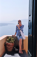 Image showing Greek woman on the streets of Oia, Santorini, Greece