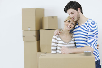 Image showing Young couple moving in new home