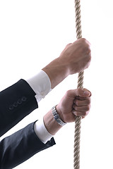 Image showing business man with rope isolated on white background