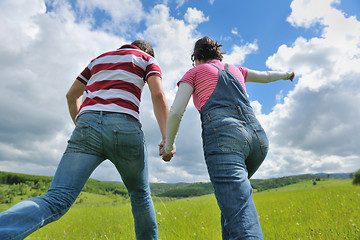 Image showing Portrait of romantic young couple smiling together outdoor