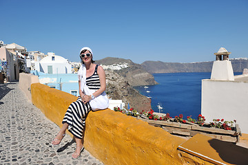 Image showing Greek woman on the streets of Oia, Santorini, Greece