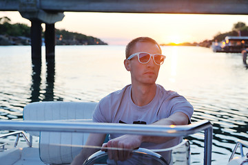 Image showing portrait of happy young man on boat