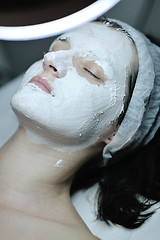 Image showing woman with facial mask in cosmetic studio